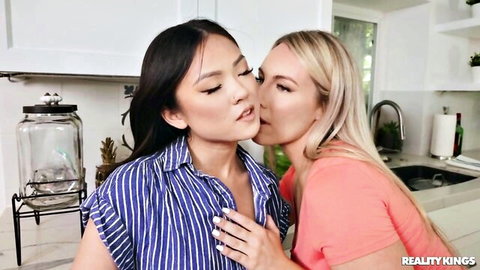 Asian and blonde stepmom kissing passionately in interracial threesome scene