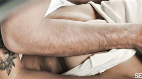 Alex Romero embraces Merida Sat intimately in bed