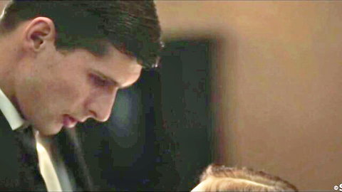 Kristof Cale gazing at Kattie Gold's blonde hair in seductive suit pose