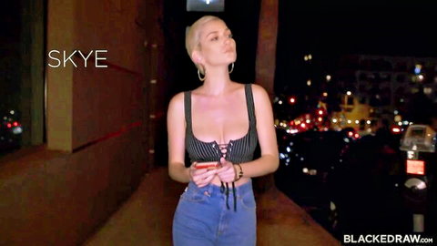 Blonde Skye in sexy black lace-up top and jeans, urban night vibe