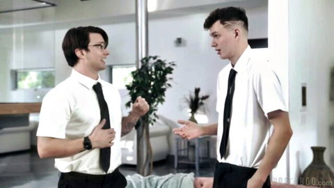 Two suited men gesturing intimately, starring Dee Williams in taboo deepthroat scene