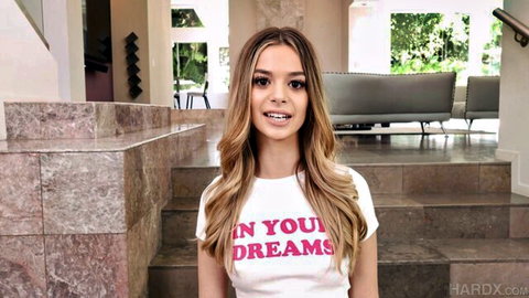 Molly Little petite blonde teen smiling in 'In Your Dreams' t-shirt