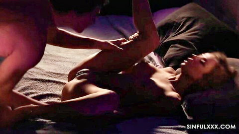Shalina Devine nude on bed with man caressing her thigh in intimate scene