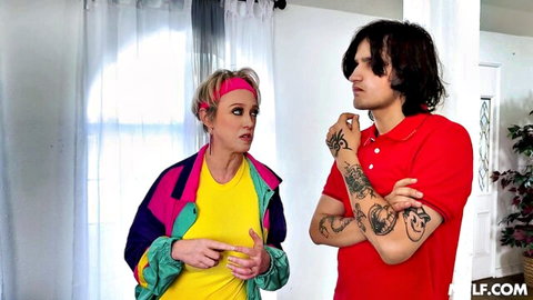Blonde woman in 80s neon jacket points finger at tattooed guy in red polo shirt