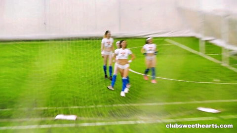 Hot athletic babes in skimpy soccer uniforms posing on field for Vulva World Cup