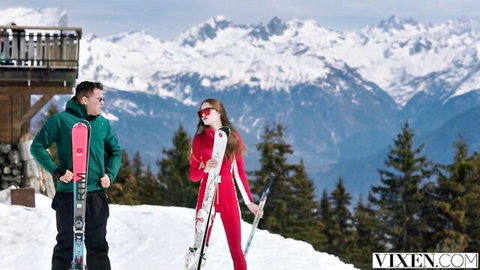 Sonya Blaze in sexy red ski suit with partner at snowy mountains