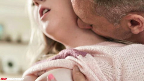 Older man passionately kissing young blonde's neck while groping her small tits in pink sweater