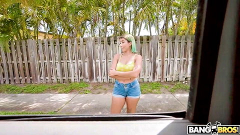 Roxie Sinner in yellow bikini top and denim shorts outside Bang Bus with Damion Dayski