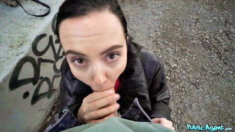 Zoe Doll kneeling for public oral on street in leather jacket