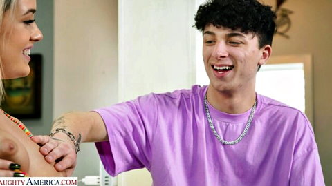 Tattooed curly-haired guy in purple shirt gropes petite blonde's small perky tits