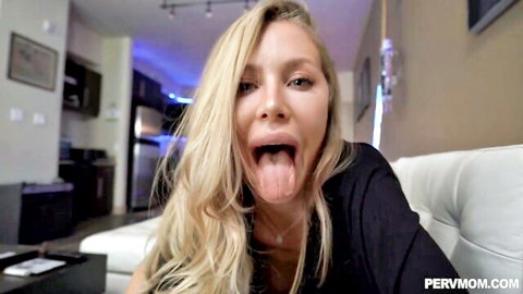 Blonde stepmom teases with tongue out in seductive close-up
