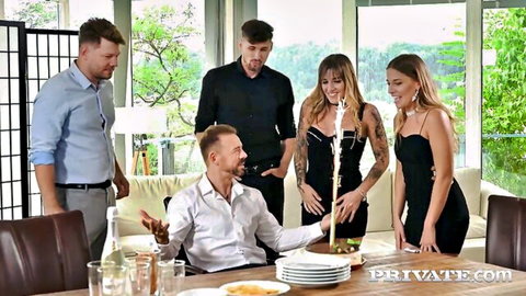 Silvia & Eveline Dellai in black dresses blowing candle with Kristof Cale, Michael Fly, Erik Everhard