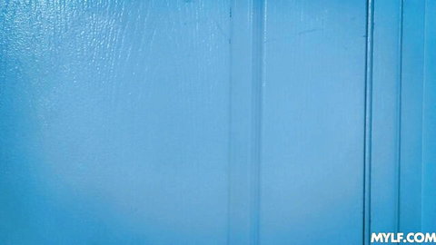 Textured blue door with MYLF.com watermark in MILF porn scene