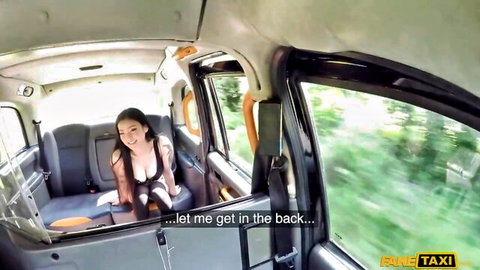 Rae Lil Black smiling seductively in Fake Taxi back seat