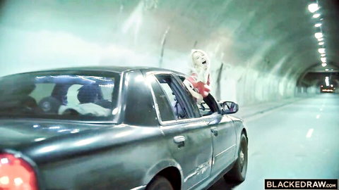 Kenzie Reeves leans out car window in tunnel, teasing wild interracial orgy