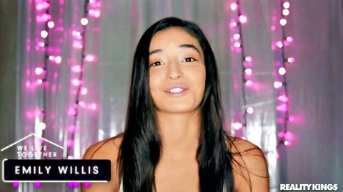 Emily Willis smiling with cleavage in pink lights, Reality Kings
