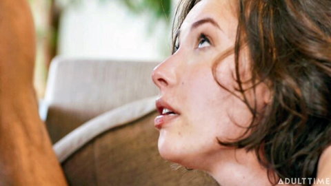 Casey Calvert looks up with open mouth in intense oral scene