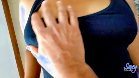 Sexy Brownis Asian model in black top with hand groping cleavage tease