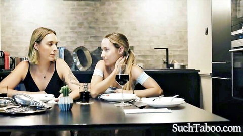 Mona Blue and blonde friend chatting over wine at dinner in taboo setup