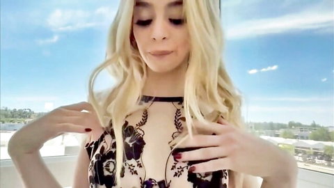 Molly Little blonde in sexy black lace dress, hands on chest pose