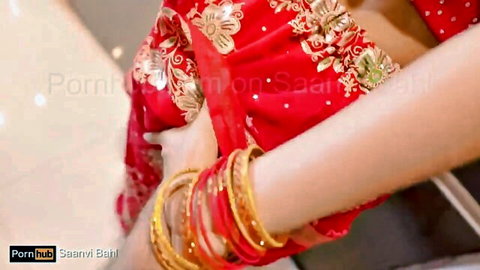 Saanvi Bahl in red saree showing curvy Indian desi midriff