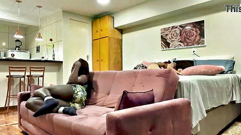 Fernanda Chocolate lounging seductively in short dress and thigh-high socks, amateur black beauty tease