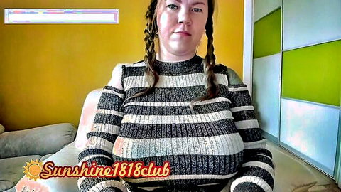 Busty pigtail webcam girl teases massive tits in tight striped sweater