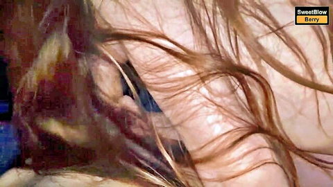 Close-up of beautiful stepsister with brown curly hair giving intense blowjob