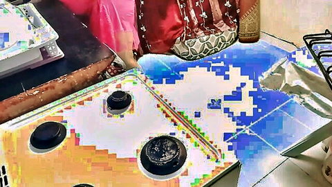 Indian woman in saree bending over during home cleaning routine