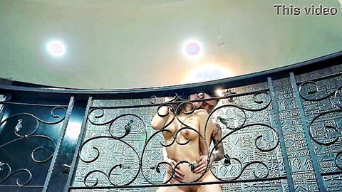Chinese girlfriend nude embraced from behind by boyfriend in standing position