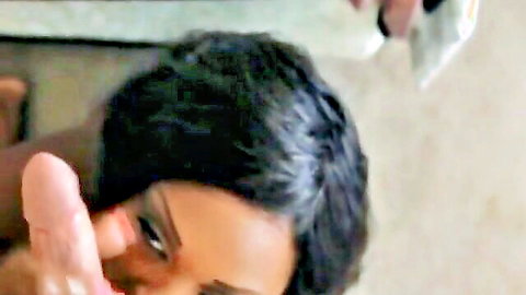 Curvy ebony mature stroking white cock in close-up