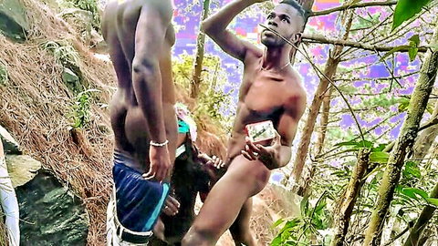 Three muscular black men in outdoor gay threesome in forest