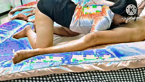 Thai student in shorts giving erotic massage to nude man
