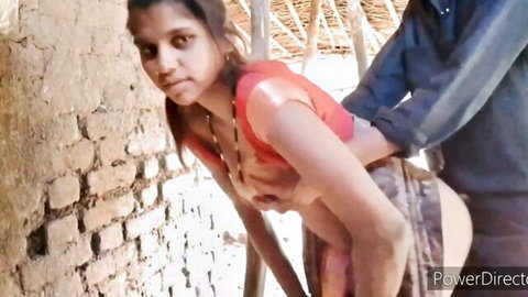 Indian teen bent over outdoor wall exposing medium tits and tight ass as man grabs her from behind