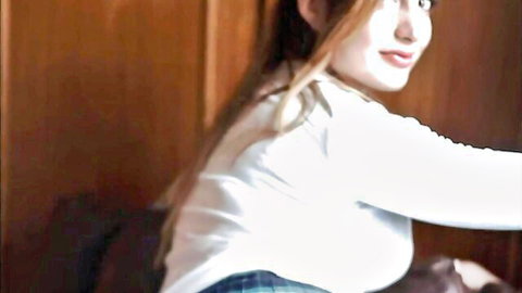 Asian woman in white top and plaid skirt poses seductively for gangbang
