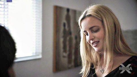 Charlie Forde blonde stepmom in black top, seductive gaze in MissaX video