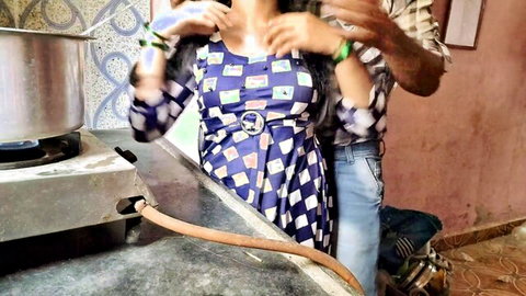 Indian couple in kitchen foreplay man groping woman's tits over checkered dress