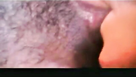 Extreme closeup of hairy wet pussy with pink labia and visible clit