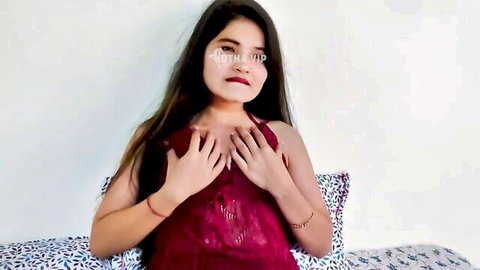 Ex-girlfriend in red lace top, teasing with hands on busty chest