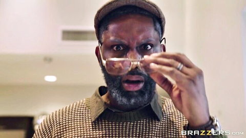 Mature Black man with beard and glasses shocked expression in Kendall Woods adult scene