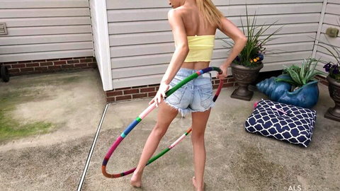 Kiara Cole in tiny denim shorts hula hooping barefoot, teasing ass and legs