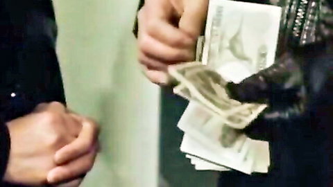 Gloved hand passing cash in steamy Japanese babe encounter, hot action setup