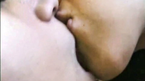 Desi Indian lesbians sharing a passionate close-up kiss