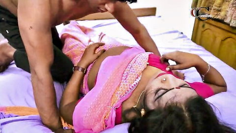 Muscular shirtless Indian man roughly mounts busty mature desi woman in pink saree on bed