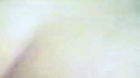 Blurry sensual pregnant wife lying nude with hand on belly