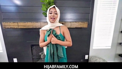 Young Arab hijab teen pulls down green slip exposing perky tits by fireplace