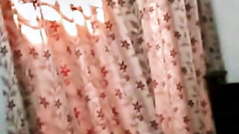 Blurry curtains in dimly lit room, teasing romantic Indian couple's nighttime romp