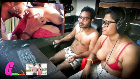 Indian bhabhi's massive tits spill from red bra while gaming with shirtless man, inset shows him sucking her nipple