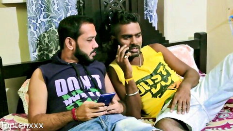 Two hot Desi guys in tank tops and shorts on bed in homemade stepbro video