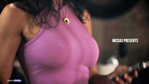 Penny Barber in tight pink tank top revealing deep cleavage